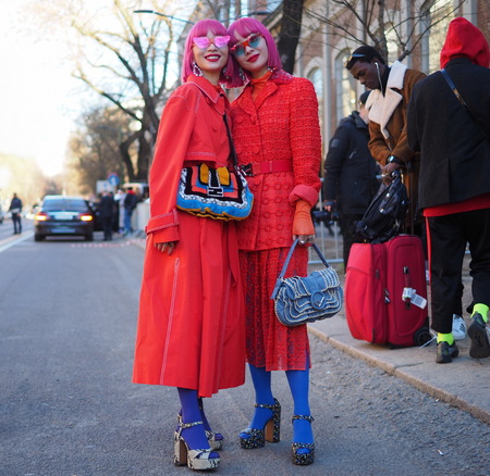 MILAN, Italy: 14 January 2019: Aya and Amiya Amiaya street style outfit after FENDI fashion show during Milan Fashion Week man Fall / winter 2019/2020のeditorial素材