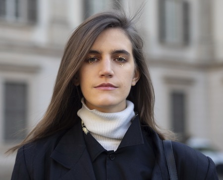 MILAN, Italy: February 24, 2019: Model posing in street style outfit after Stella Jean fashion show during Milan fashion week Fall / winter 2019/2020のeditorial素材