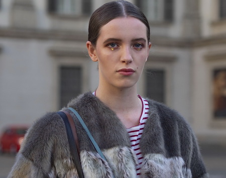 MILAN, Italy: February 24, 2019: Model posing in street style outfit after Stella Jean fashion show during Milan fashion week Fall / winter 2019/2020のeditorial素材
