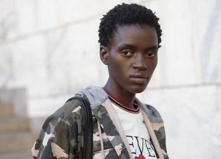 MILAN, Italy: February 24, 2019: Model posing in street style outfit after Stella Jean fashion show during Milan fashion week Fall / winter 2019/2020のeditorial素材