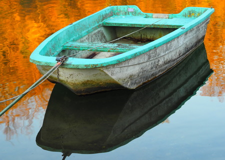 A blue boat on Adda river, Lombardy, Italy.の写真素材