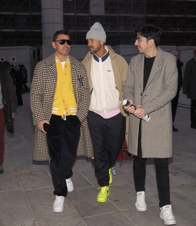MILAN, Italy: 12 January 2019: Fashion in street style outfits before Neil Barrett fashion show during Milan fashion week Man fall / winter 2019/2020.のeditorial素材