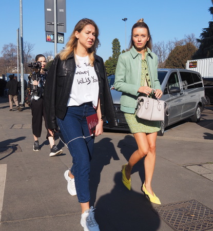 MILAN, Italy: February 22, 2019: Models style street outfits after TOD'S fashion show during Milan fashion week Fall / winter 2019/2020のeditorial素材