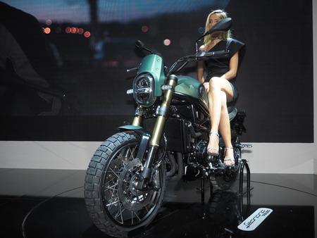 MILAN, ITALY - NOVEMBER 7, 2019: Model on motorbike at EICMA, international motorcycle exhibition, Lombardy, Italy.のeditorial素材
