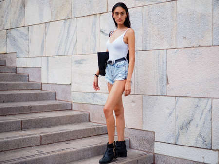 MILAN, Italy: September 21, 2018: Fashion bloggers and models in Duomo square after ACT 1 fashion...