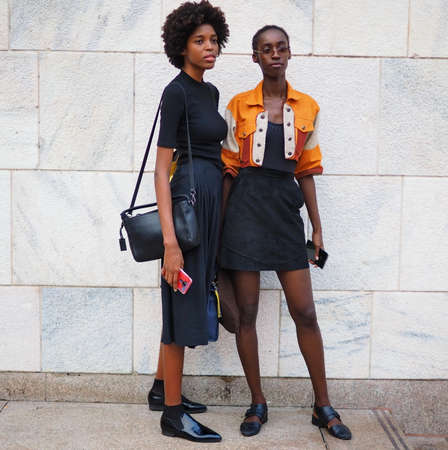 MILAN, Italy: September 21, 2018: Fashion bloggers and models in Duomo square after ACT 1 fashion show during MFW fall / winter 2018/2019.のeditorial素材