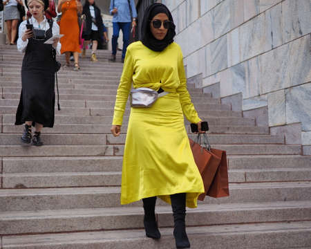 MILAN, Italy: September 21, 2018: Model posing for photographers in Duomo square after ACT 1 fashion show during MFW fall / winter 2018/2019.のeditorial素材