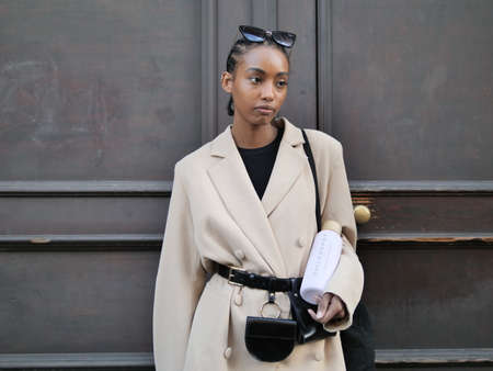 Model posing for photographers in the street after philosophy by Lorenzo Serafini during Milano...