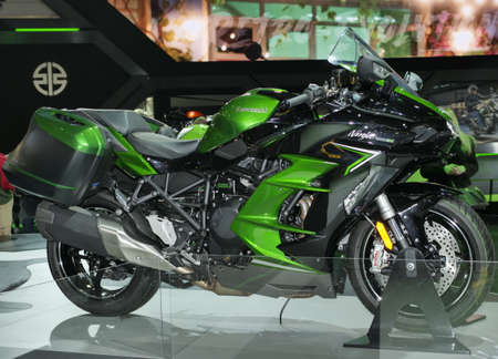 Girls, Motorbikes and accessories exposed at EICMA, international motorcycle exhibition, Lombardy,...