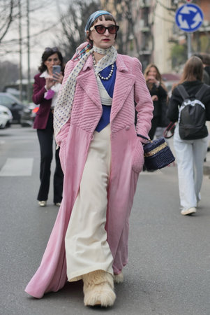 Milan, Italy February 2022: Fashion blogger street style outfit before Armani fashion show during Milano Fashion week 2022のeditorial素材