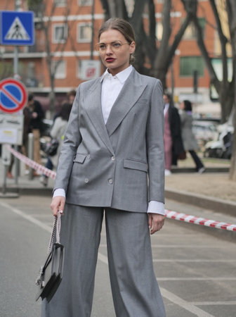 Milan, Italy February 2022: Fashion blogger street style outfit before Armani fashion show during Milano Fashion week 2022のeditorial素材