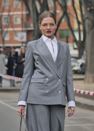 Milan, Italy February 2022: Fashion blogger street style outfit before Armani fashion show during Milano Fashion week 2022のeditorial素材