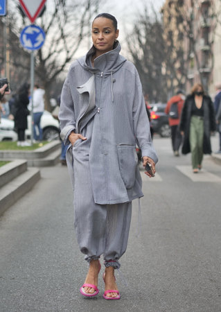 MILAN, Italy: February 2022: Fashion blogger street style outfit before Armani fashion show during Milan fashion week Fall/winter 2022のeditorial素材