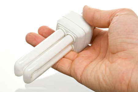 bulb energy saving in the hand on white background