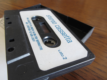 Vintage audio cassette tape on wooden tableの写真素材