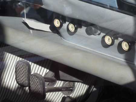 Dashboard and pedals of a classic vintage car . Nostalgia concept