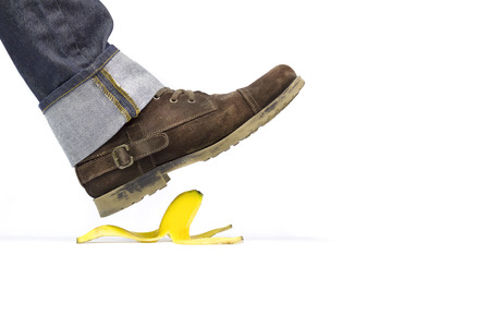 About to slide with a banana peelの写真素材