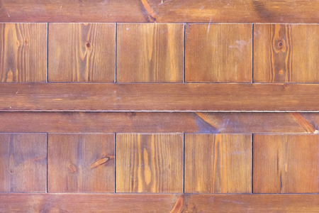 Square pattern on a wooden surface