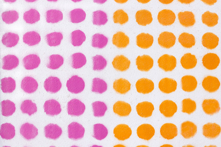 Orange and pink dot pattern over a white background.の写真素材