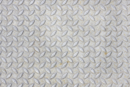 Grey metallic surface with cross patternの写真素材