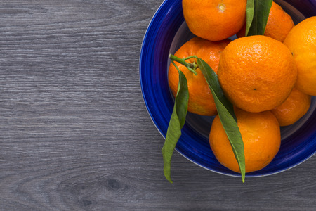 Clementines is a blue bowlの写真素材