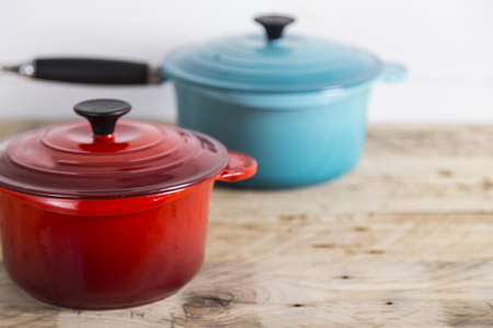 Blue and red saucepansの写真素材