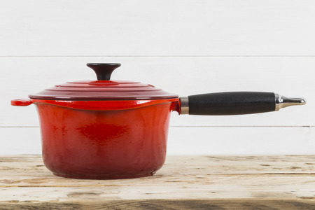 Single red saucepan with lidの写真素材