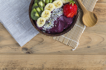 Acai bowl with spoon and napkinの写真素材