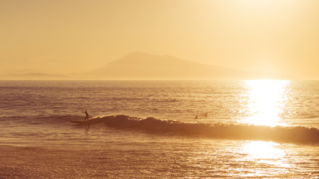 Surfer at sunsetの写真素材