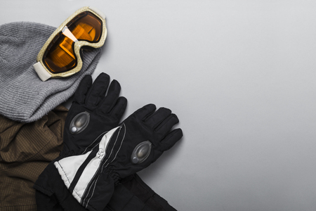 Skiing clothes including jacket, hat, gloves and goggles.の写真素材