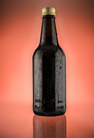 Bottle photographed on a luminous Red backgroundの写真素材