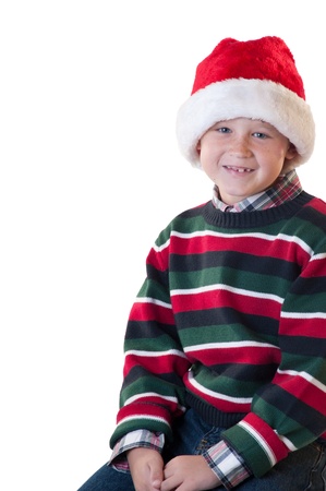 White isolation young boy wearing santa hat smilingの写真素材