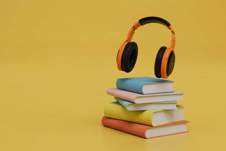 listening to audiobooks. books and headphones on a yellow background. 3D rendering.の写真素材