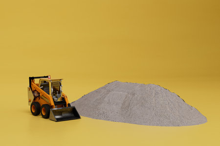 the concept of a large construction site. excavator and sand on a yellow background. 3d rendering.の写真素材