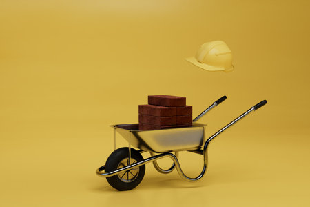 construction wheelbarrow with bricks and a safety helmet on a yellow background. 3d rendering.の写真素材
