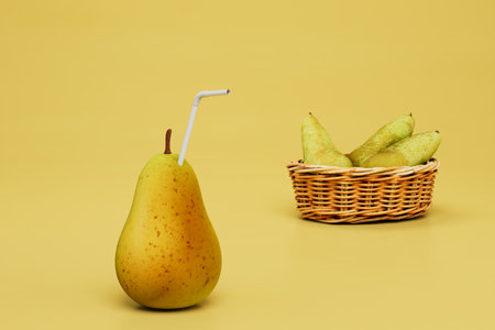 useful pear juice. vitamin cocktail with a straw in a pear next to pear in a basket. 3d rendering.の写真素材
