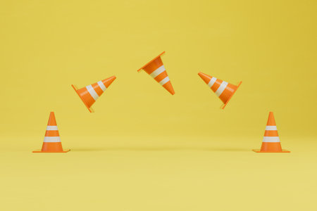 road cones, fences. travel cones flying on a yellow background. 3D rendering.の写真素材