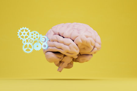 the concept of the brain. next to which gears are illuminated by neon on a yellow background. 3D rendering.の写真素材