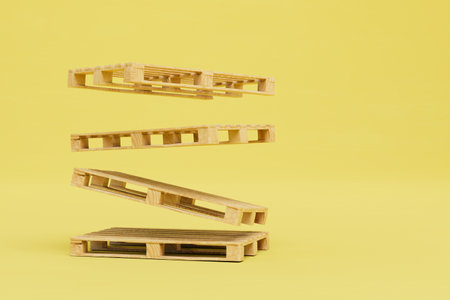 wooden pallets flying on a yellow background. 3D rendering.の写真素材