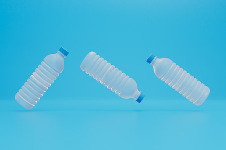 recycling of plastic bottles. empty plastic bottles flying on a blue background. 3D rendering.の写真素材
