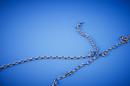 Metal chains isolated on blue background. 3d rendering.の写真素材
