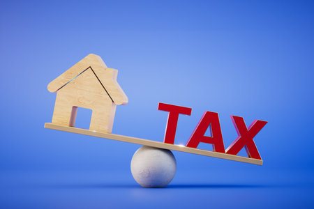 High property tax. The house and the inscription tax on the scales on a blue background. 3D rendering.の写真素材