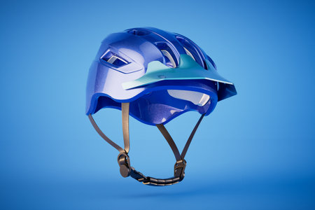 blue bicycle helmet isolated on blue background. 3d rendering.の写真素材
