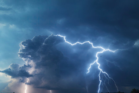 There are many lightning bolts against the black sky. Night photo of a thunderstorm on a long exposureの素材