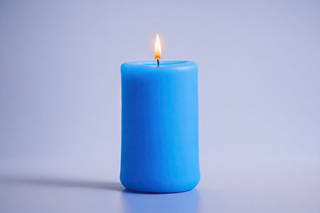 Blue pillar wax candle on white background. ai generative.の素材