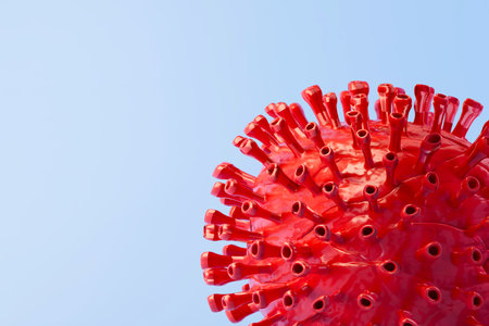 red virus cell on blue background. 3d render. illustration.の写真素材