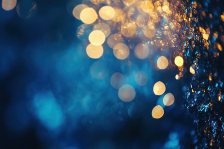 Elegant blue and gold hues with shimmering bokeh light effects, symbolizing festive celebrations, luxury, and New Year's Eve magic.の素材
