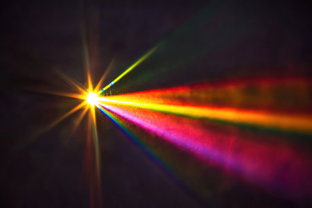 Abstract glowing bokeh and lens flare texture with prism light effect on dark background, ideal for overlays and visual art.の素材