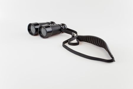 Old binoculars isolated on whiteの写真素材