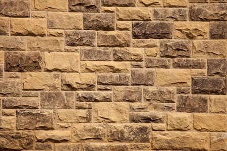 Stone wall of natural stones .  Fragment of a Stone wall of natural stones の写真素材